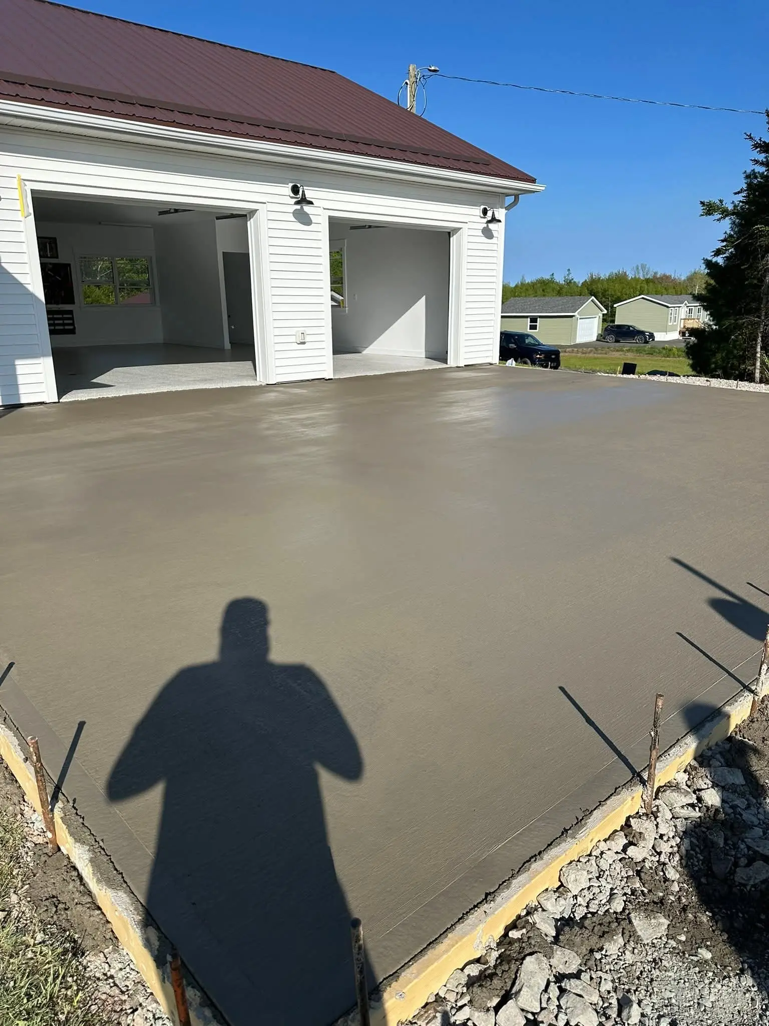 Finished concrete apron in front of a double garage