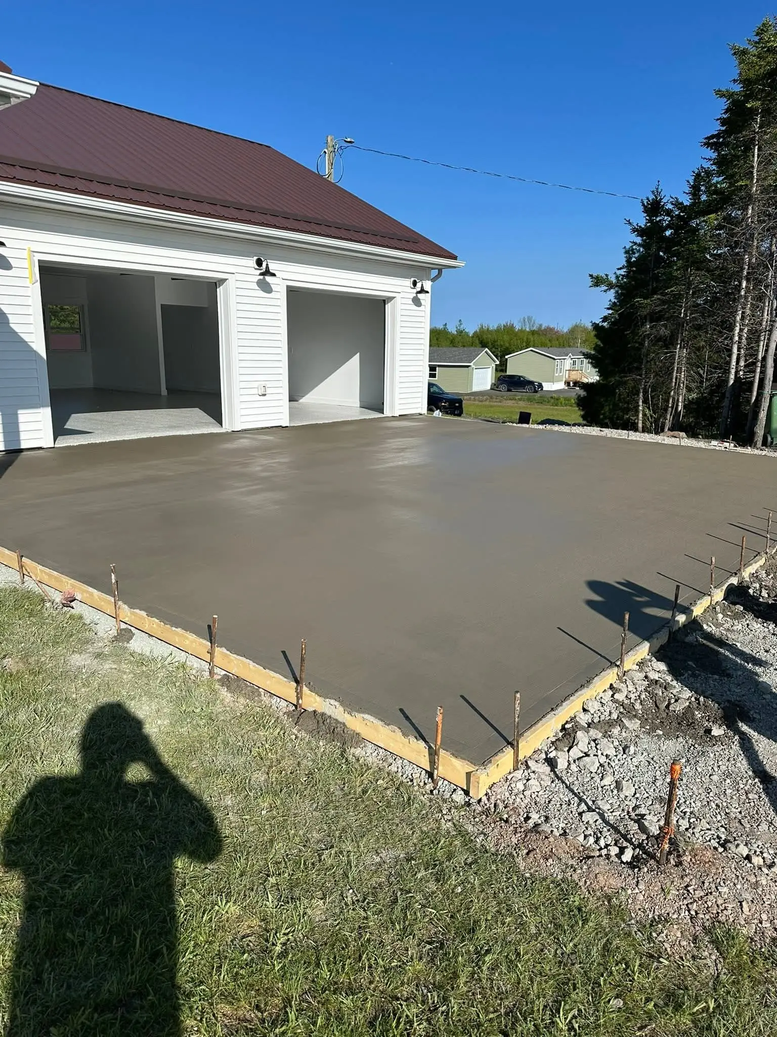 Concrete garage apron just poured inside its forms