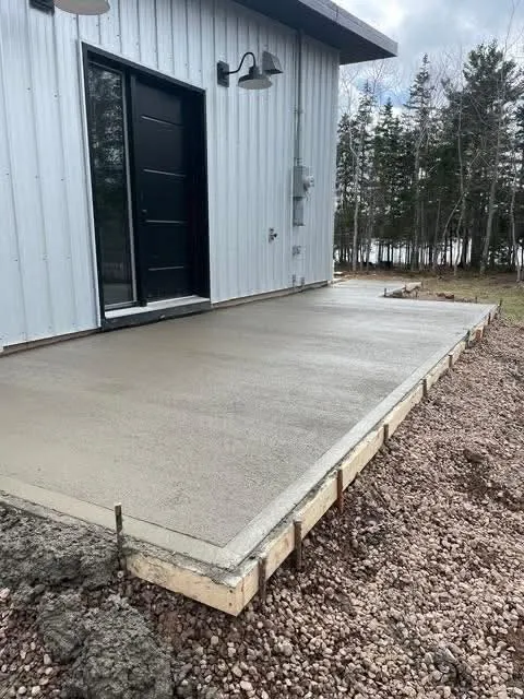 After: finished concrete patio at the same back door